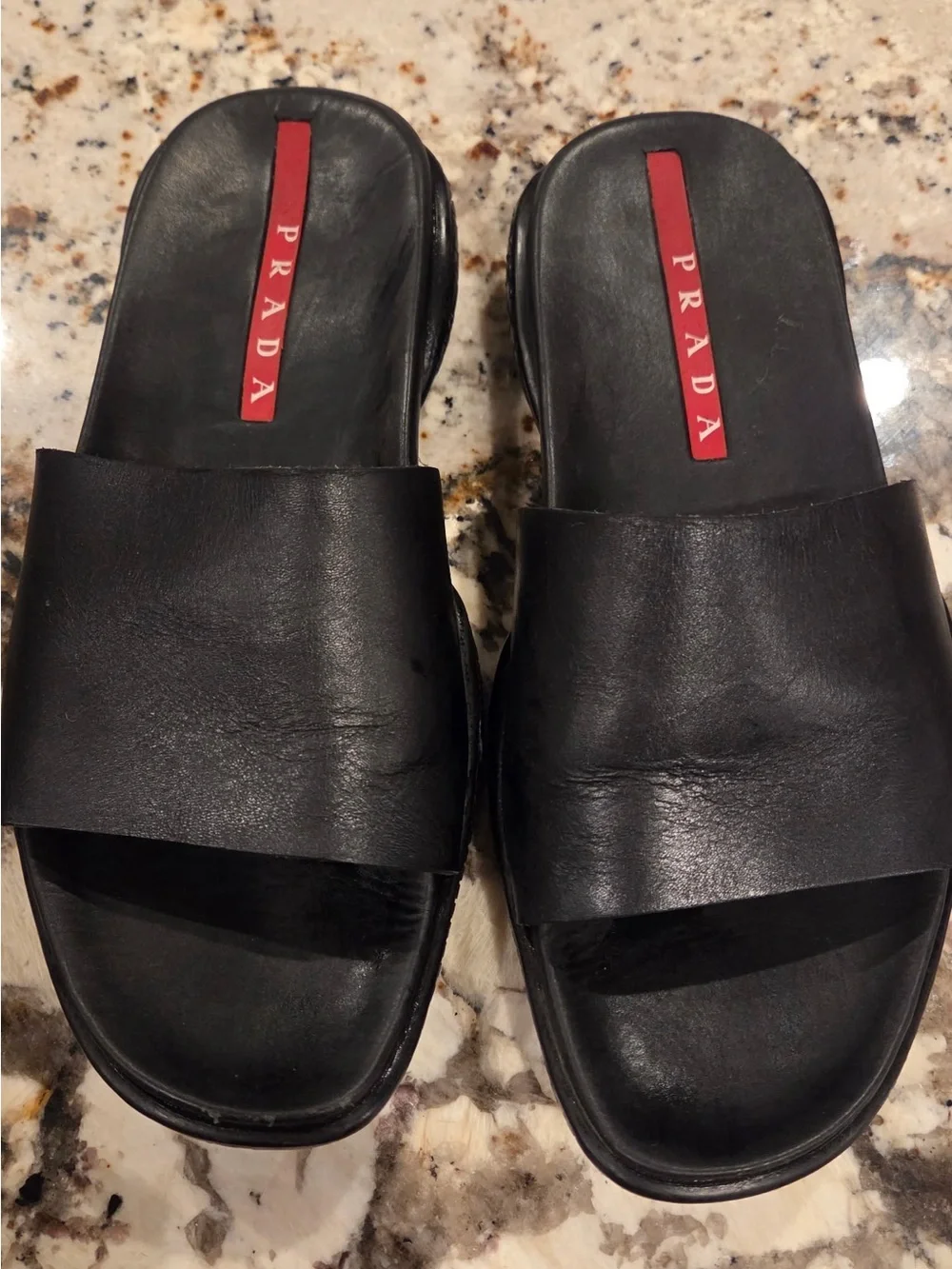 Prada Black Leather Slide Sandals with Red Logo Inlay
